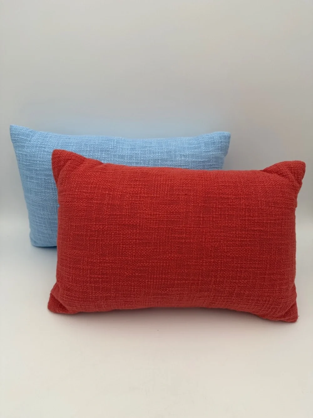 Set of Two Decorative Pillows in Light Blue and Red